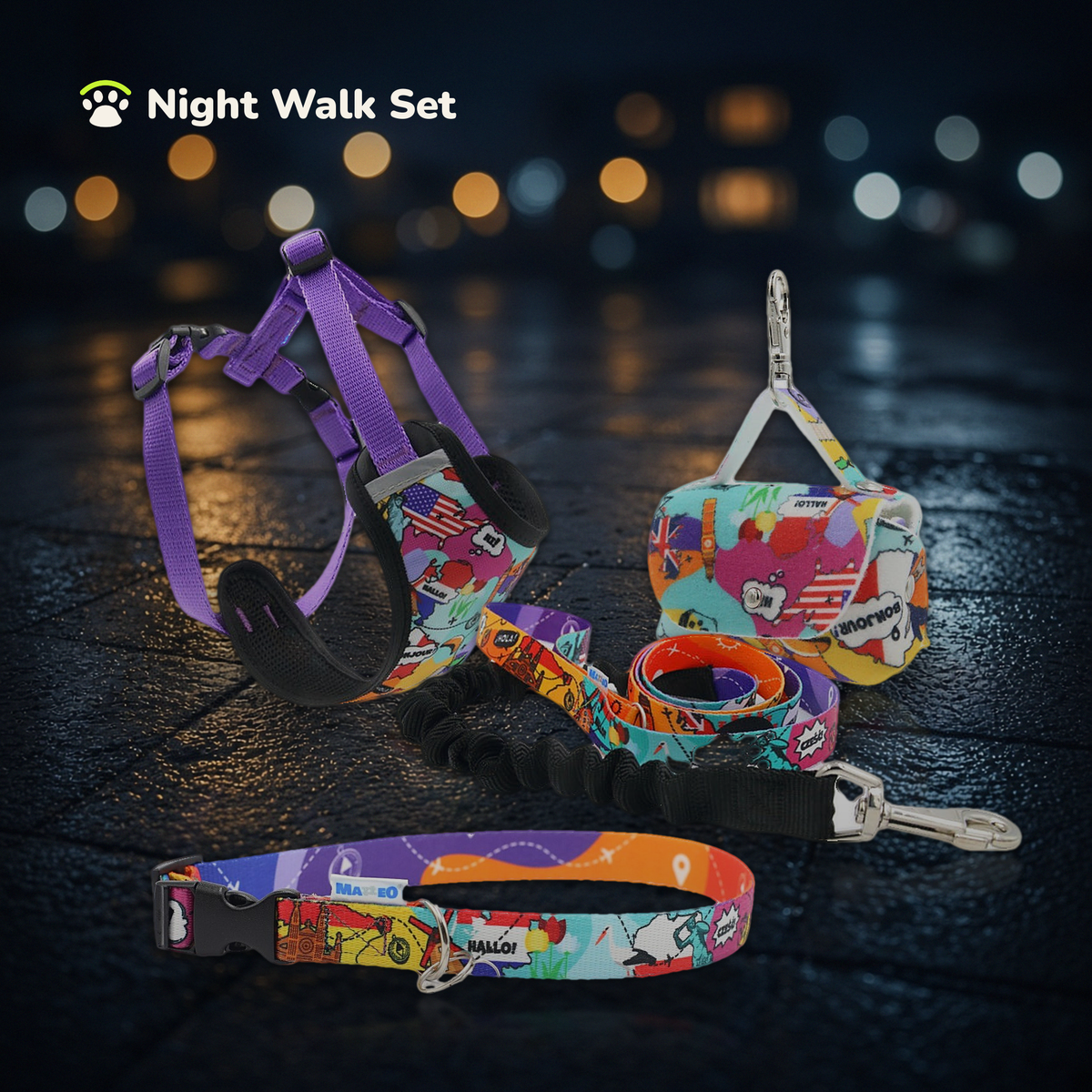Night Walk Set in Travel print: pressure-free harness, shock-absorbing lead, collar and poo-bag holder on a wet street at night